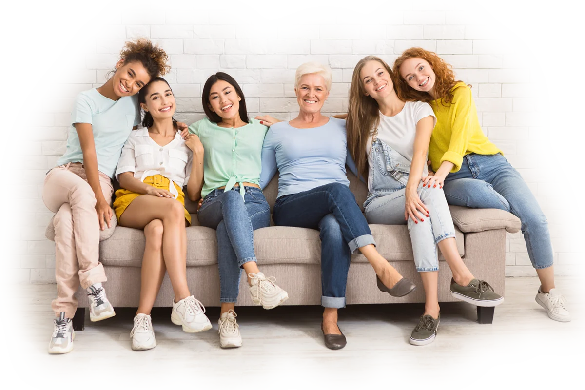 Women of different ages — together sitting on sofa